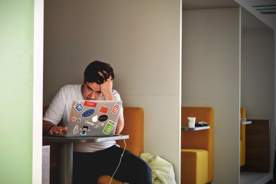 Trader under pressure at a laptop